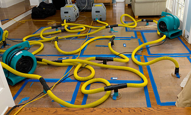Professional Flood Damage Restoration technician working in Atoka, TN